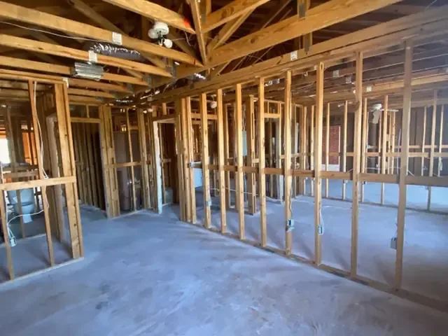 Room stripped to the studs so the framing can be dried to target readings
